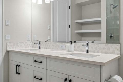 Shared bathroom with double sinks keeps the whole family moving in the morning