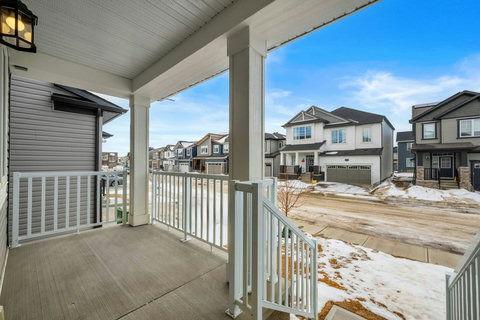 Relax on the charming covered front porch with neighborhood views