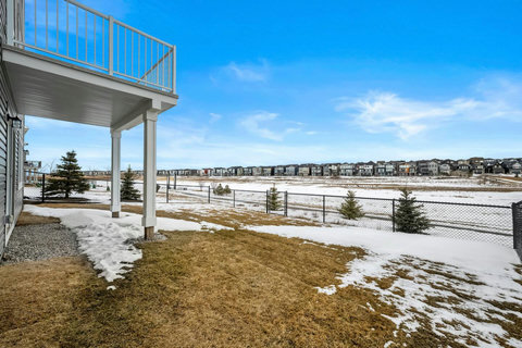 Enjoy serene open field views from your private fenced backyard