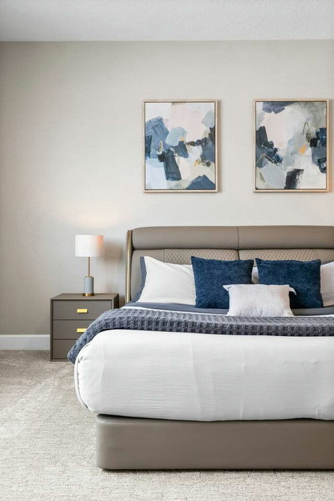 Wake up refreshed in a beautifully styled king bed with designer wall art