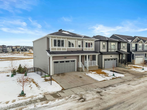 Perfectly situated corner home with extra-wide driveway and open surroundings