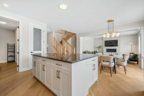 Beautifully designed kitchen flows into the open dining and living space