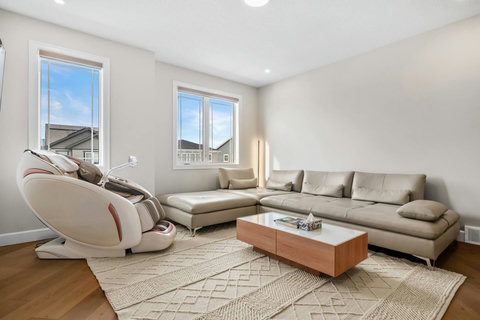Sink into a luxurious sectional sofa in this bright, airy living space
