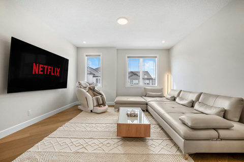 Unwind on the plush sectional and stream your favourite shows