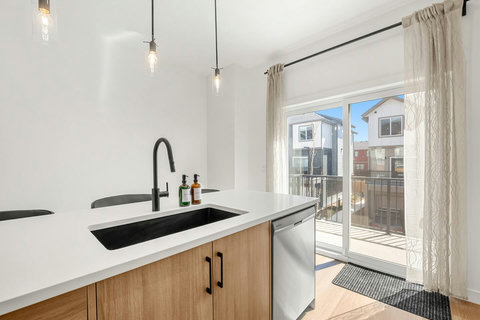 Bright modern kitchen with sleek island and stunning city views