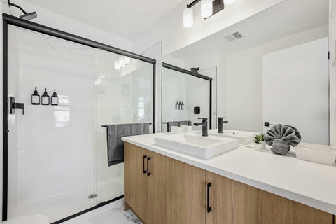 Spa-like master bath with plenty of natural light and storage