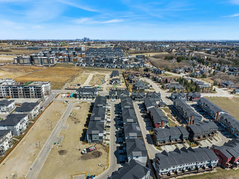 Expansive aerial perspective showcasing the vibrant community and distant cityscape