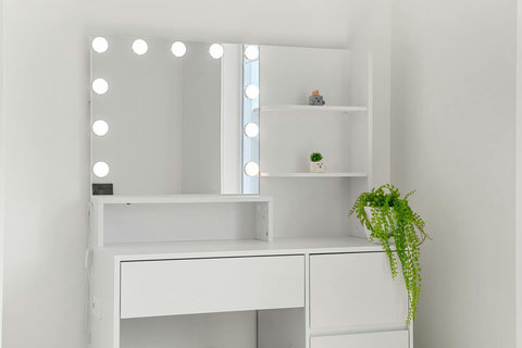 Spa-like bathroom with Hollywood-style vanity and ample storage