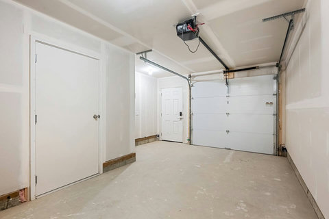 Convenient two-car garage with automatic door opener and storage