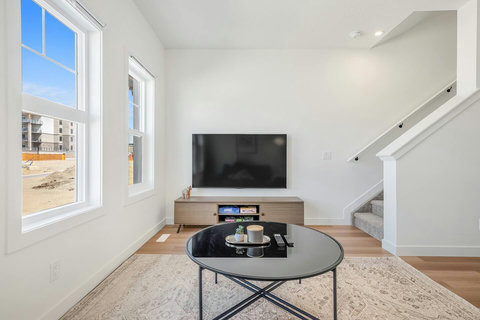Bright, airy living room with smart TV and stylish furnishings