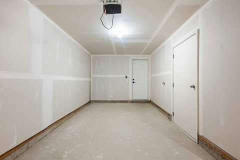 Spacious garage with ample storage and parking space available
