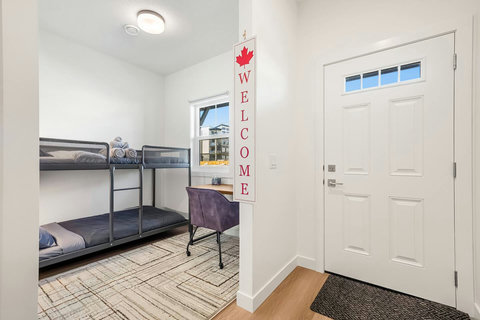 Welcoming guest bedroom with comfortable bunk beds and natural light