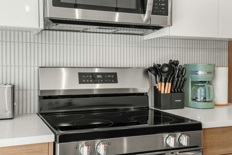 Chef's kitchen featuring sleek stainless steel appliances and modern cooking essentials