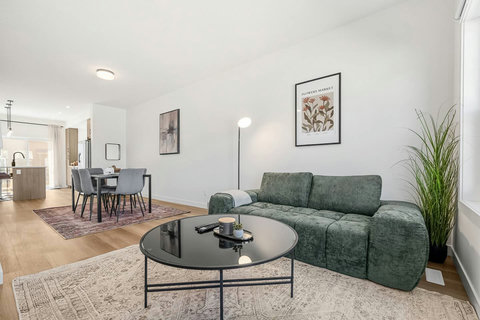 Bright open-concept living room with comfortable seating and modern décor