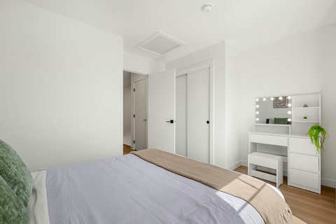Serene bedroom with Hollywood vanity and direct bathroom access