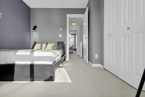 Stylish master bedroom with contemporary design and ocean view access