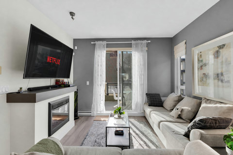 Stylish living space with gas fireplace and direct patio access