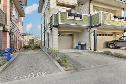 Convenient driveway access with attached garage and dedicated parking space