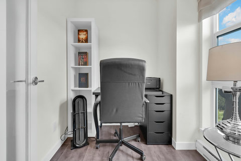 Dedicated workspace with built-in shelving and natural light