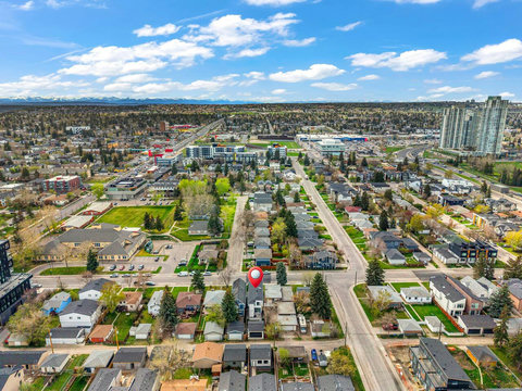 Stunning bird's eye view of vibrant neighborhoods and distant mountain peaks