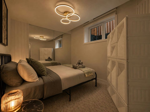 Stylish guest bedroom featuring contemporary ring lighting and full-length mirrored closet