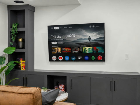 Comfortable living room with large smart TV and streaming entertainment options