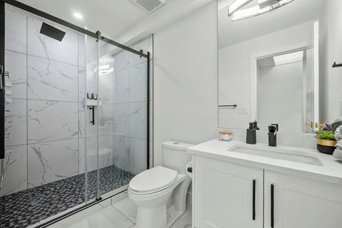 Spa-like bathroom featuring marble accents and contemporary finishes.