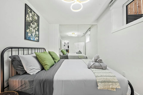 Stylish guest bedroom with contemporary design and ample natural light