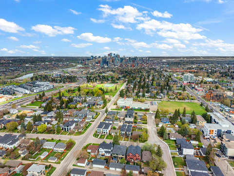 Stunning aerial perspective of the vibrant city skyline and tree-lined neighborhoods