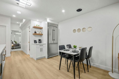 Sleek open kitchen and dining area perfect for cooking and entertaining together