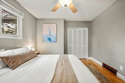 Serene guest bedroom with nautical touches and natural light