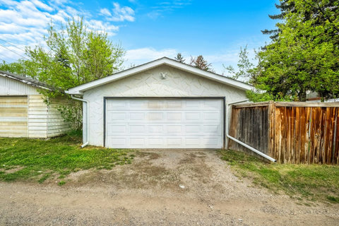 Convenient two-car garage with ample driveway parking space