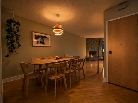 Warm dining space with stylish wooden table and comfortable seating