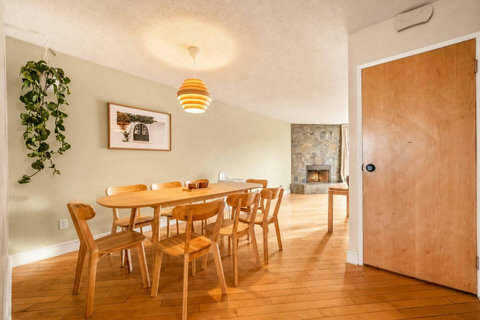 Warm mid-century dining space perfect for gatherings and shared meals