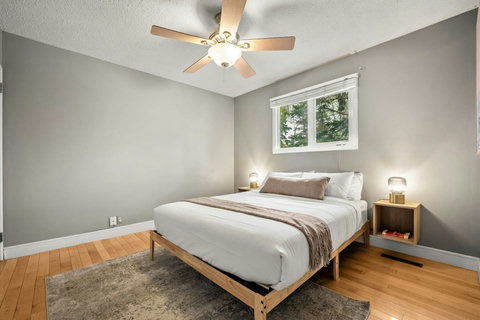 Serene guest bedroom with natural light and modern furnishings