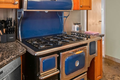 Charming vintage gas range brings character and warmth to the kitchen