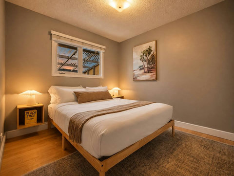 Cozy guest bedroom with warm ambiance and thoughtful mid-century modern styling