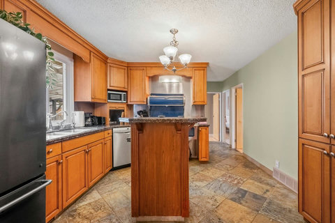 Warm wood kitchen with ample counter space and welcoming island