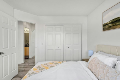 Comfortable primary bedroom with ample closet storage and natural light