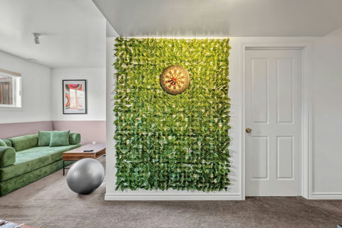 Contemporary living space with vibrant living wall and natural daylight