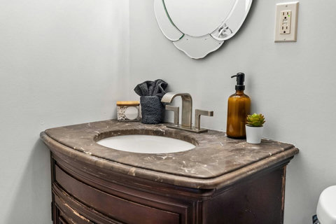 Stylish marble vanity with brushed nickel faucet and spa-like touches.