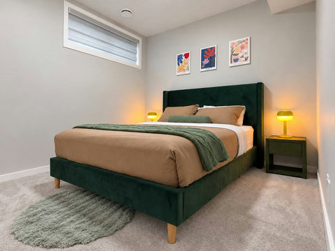 Bedroom 1: queen bed and window