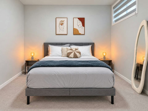 Bedroom 2: queen bed with nightstands and lamps