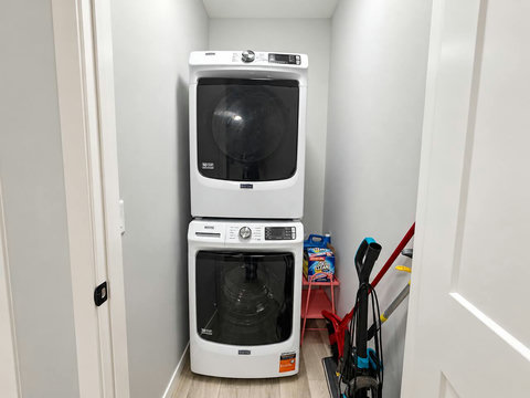 In-suite stacked washer and dryer