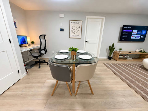 Dining table for 4 beside a dedicated workspace