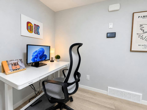 Dedicated workspace with monitor and ergonomic chair