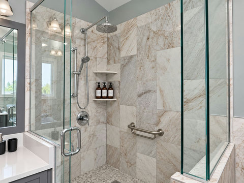 Separate glass shower in the primary ensuite bathroom.
