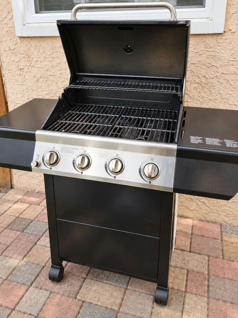 Four-burner barbecue in the backyard.