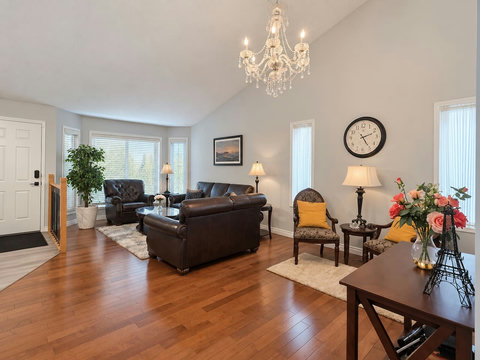 Front living room on the main floor, separate from the family room with the TV and fireplace.
