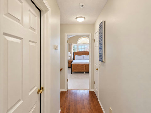 Upstairs hallway connecting the three bedrooms and bathrooms.